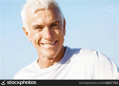 Portrait of healthy senior man. Portrait of healthy senior man smiling at camera