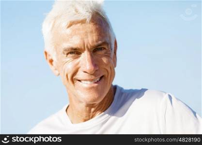Portrait of healthy senior man. Portrait of healthy senior man smiling at camera