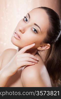 Portrait of healthy woman with golden make-up - spa concept