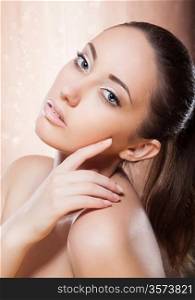 Portrait of healthy woman with golden make-up - spa concept