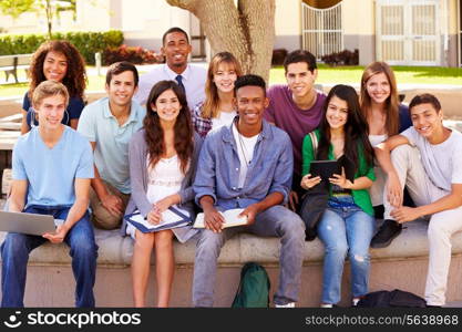 Portrait Of High School Students With Teacher On Campus