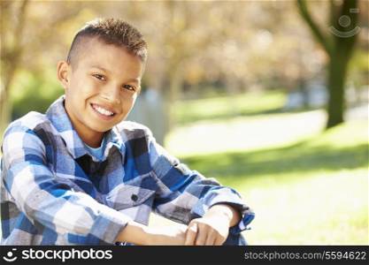 Portrait Of Hispanic Boy In Countryside