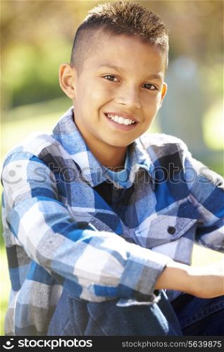 Portrait Of Hispanic Boy In Countryside