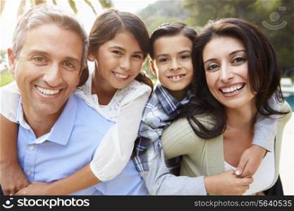 Portrait Of Hispanic Family In Countryside