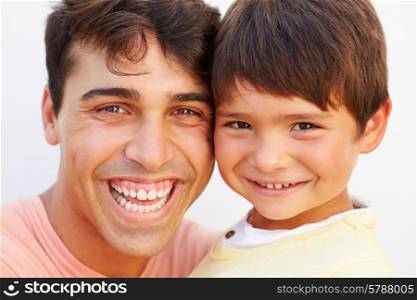 Portrait Of Hispanic Father And Son