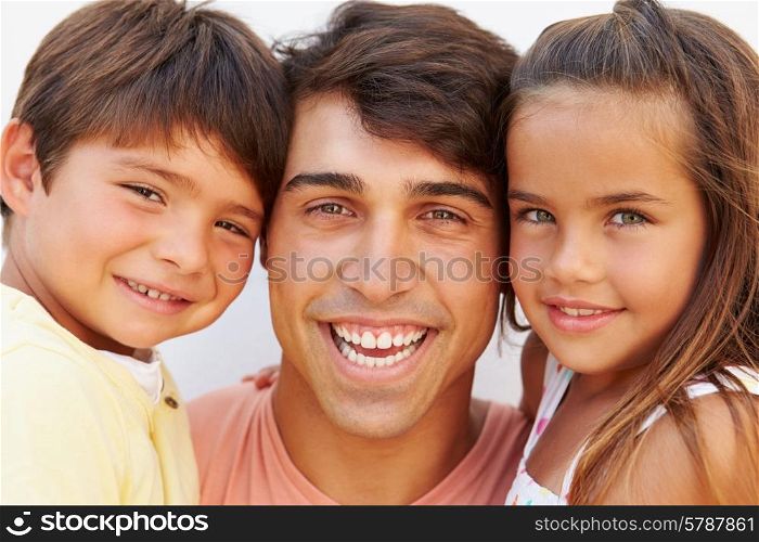 Portrait Of Hispanic Father With Children