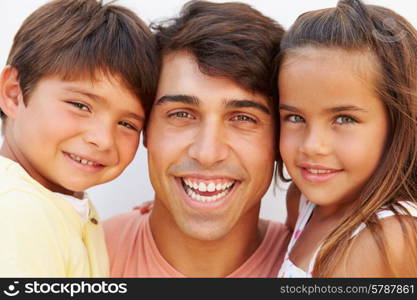 Portrait Of Hispanic Father With Children