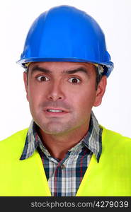 Portrait of horrified builder