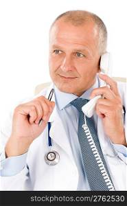 Portrait of hospital professional doctor with stethoscope on phone isolated