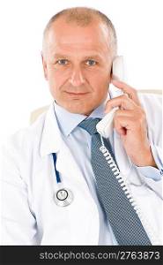Portrait of hospital professional doctor with stethoscope on phone isolated
