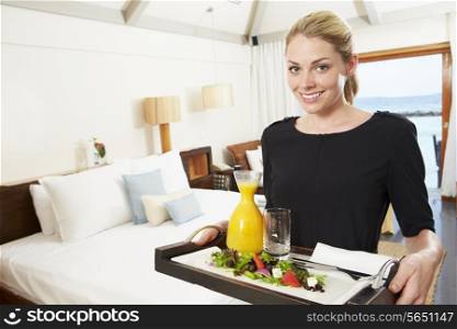 Portrait Of Hotel Worker Delivering Room Service Meal