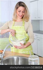 Portrait of housewife preparing meal