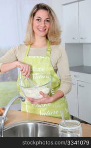 Portrait of housewife preparing meal
