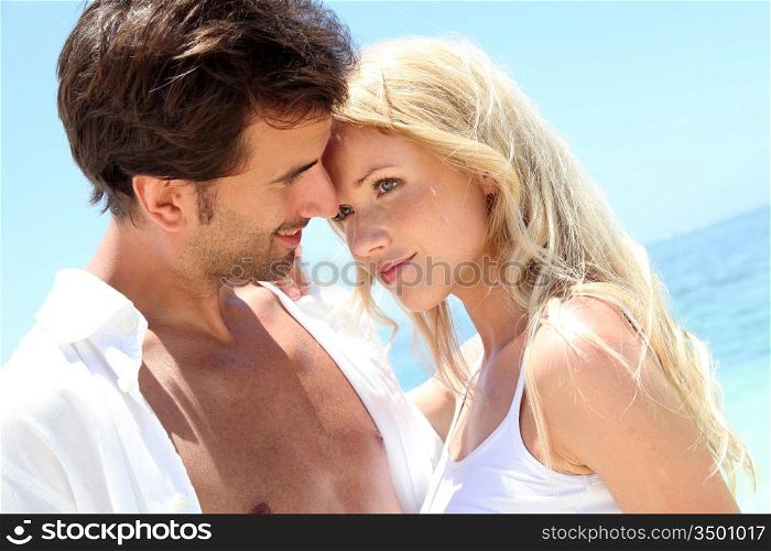 Portrait of in loved couple on beach holidays