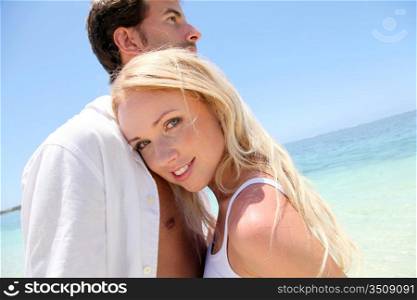 Portrait of in loved couple on beach holidays
