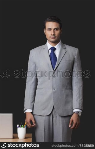 Portrait of Indian businessman standing in office
