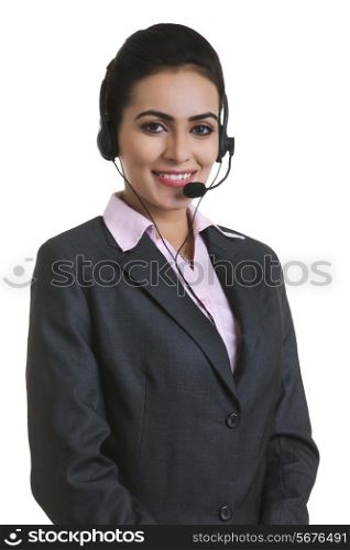 Portrait of Indian businesswoman wearing headset isolated over white background