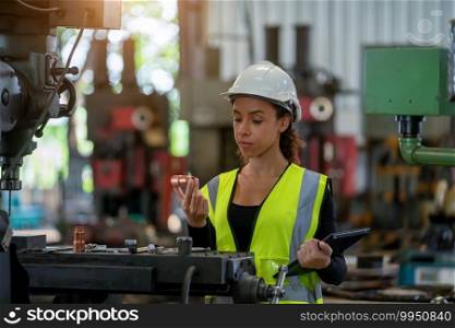 Portrait of industrial woman engineer working in a factory.