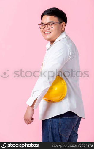 Portrait of Industry worker or engineer working an architect builder studying working and the side eyes looking at camera in isolated on pink blank copy space studio background,indoor studio