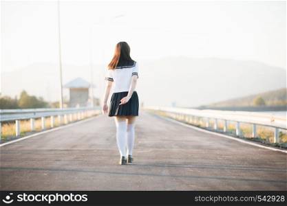 Portrait of Japanese school girl uniform smile with walkway and river