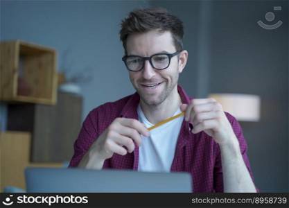 Portrait of joyful Austrian tutor in glasses having german language video classes online, young male teacher schooling remotely from home having linguistic trainings with students by conference call. Portrait of joyful Austrian tutor in glasses having german language video classes online