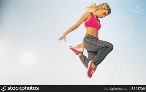 Portrait of jumping slim woman