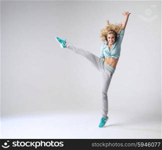 Portrait of jumpng girl with headphones