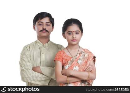 Portrait of kids dressed as husband and wife