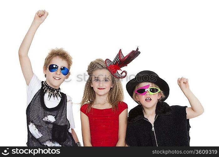 Portrait of kids fancy dress outfit with raised fist over white background