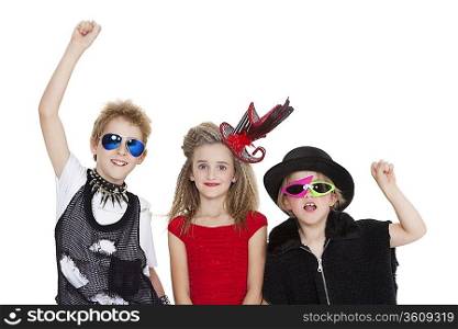 Portrait of kids fancy dress outfit with raised fist over white background