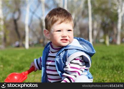 portrait of little boy in spring park