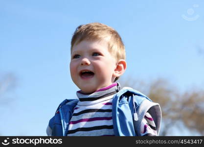 portrait of little boy in spring park