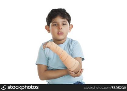 Portrait of little boy with injured arm