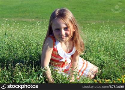 portrait of little fashionable girl on the nature