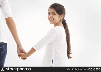 Portrait of little girl holding mother&rsquo;s hand