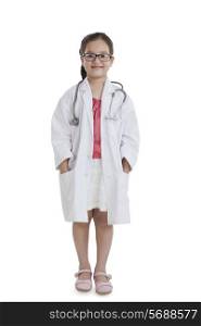 Portrait of little girl posing as a doctor