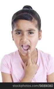 Portrait of little girl showing her teeth