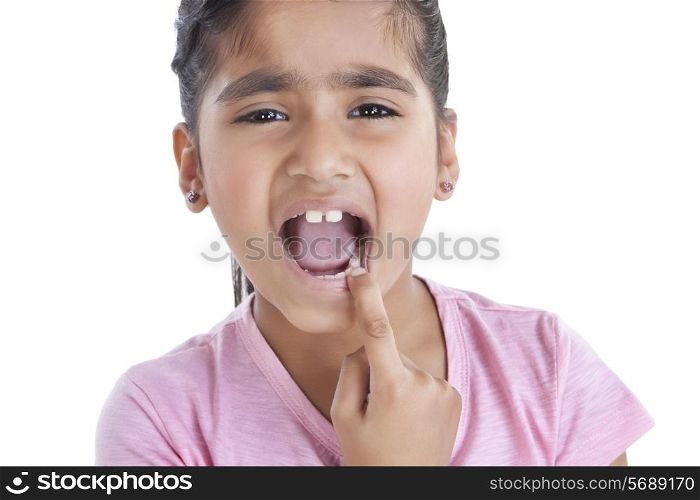 Portrait of little girl showing her teeth