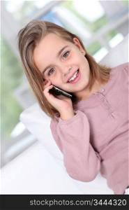 Portrait of little girl talking on mobile phone