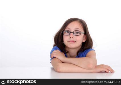 Portrait of little girl with bue shirt doing faces
