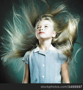 Portrait of little girl with magnificent hair