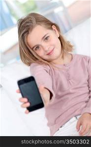 Portrait of little girl with mobile phone