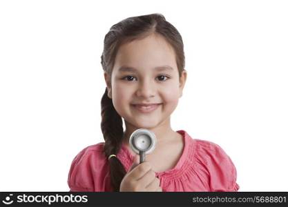 Portrait of little girl with stethoscope