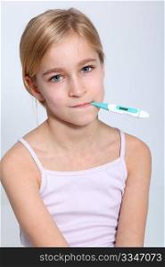 Portrait of little girl with thermometer into mouth