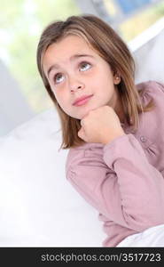 Portrait of little girl with thoughtful look