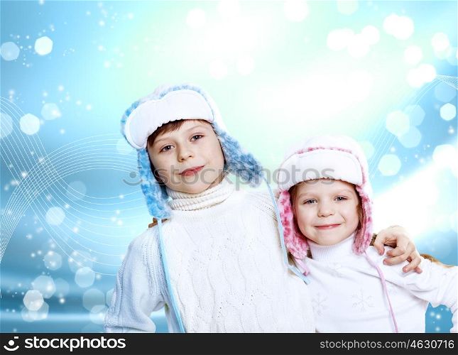 Portrait of little kid in winter wear against snow background