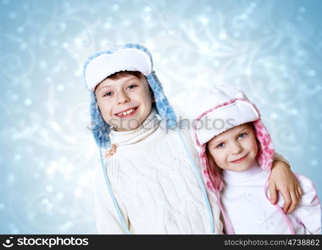 Portrait of little kid in winter wear against snow background