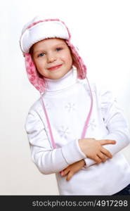 Portrait of little kid in winter wear against white background