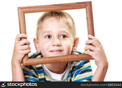 Portrait of little smiling blonde boy child holding photo frame framing his face studio shot isolated on white