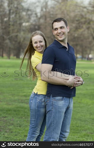 Portrait of love couple embracing outdoor